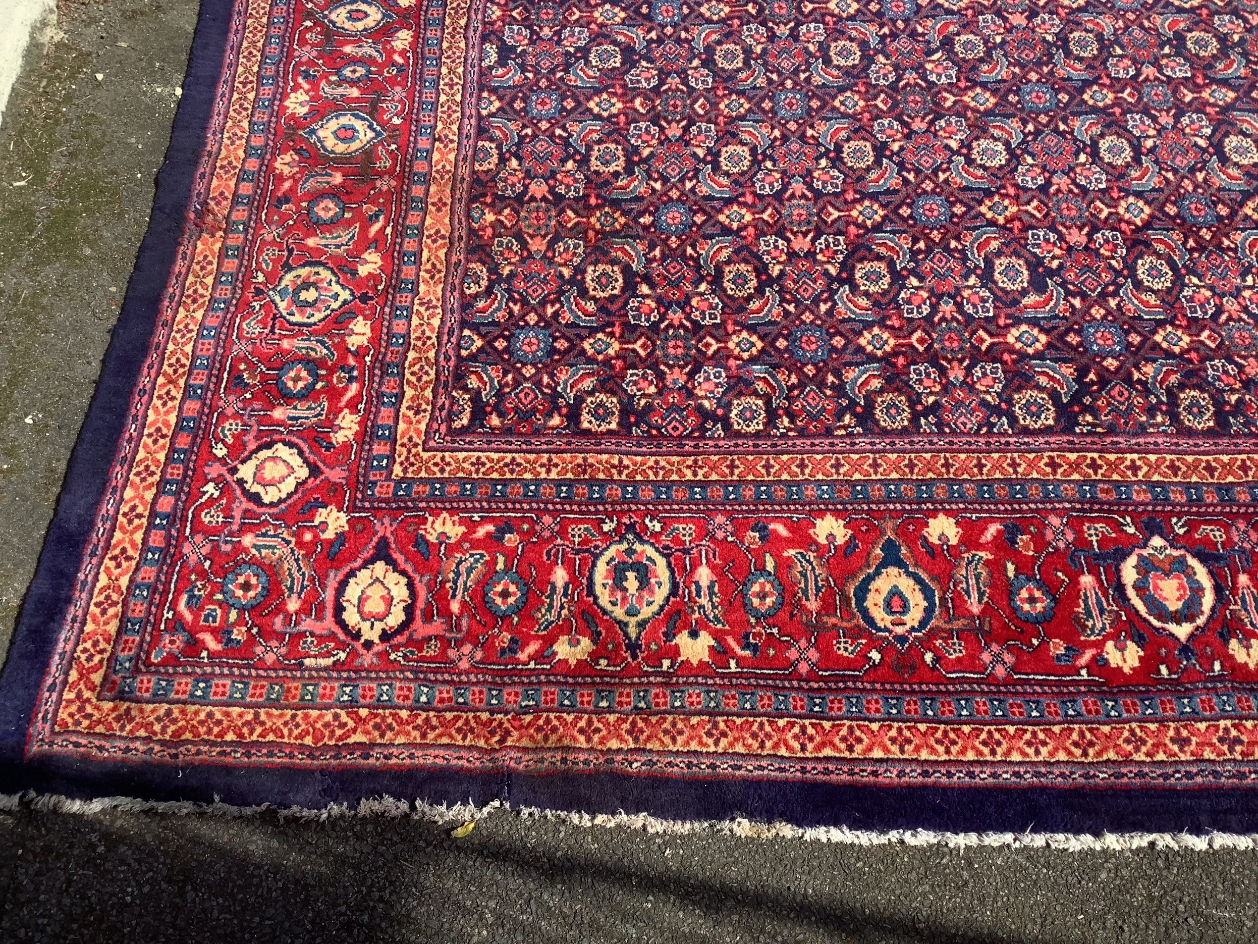 A North West Persian blue ground carpet, 534 x 325cm